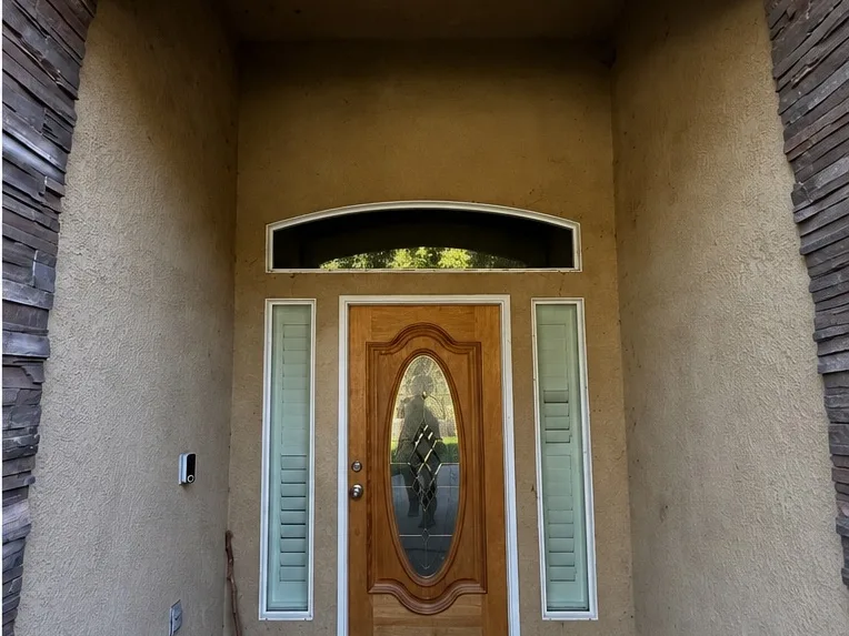 Before: a stucco front entryway with stone steps