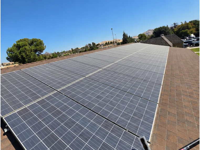 Before: a rooftop solar array covered in Central Valley dust