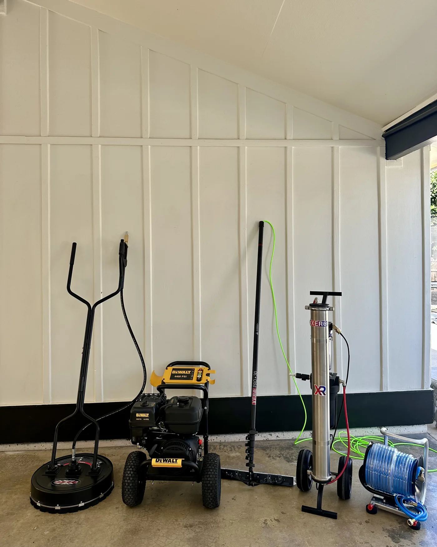 Valley Peak's equipment: surface cleaner, 4400 PSI pressure washer, water-fed pole, deionization system and hose reel