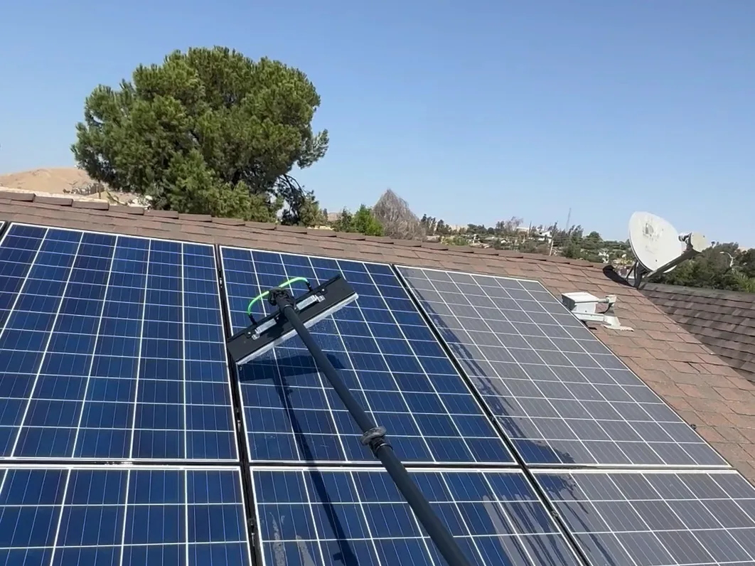 Rooftop solar array in Porterville halfway through a cleaning